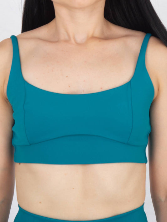 Top deportivo femenino esencial verde azul