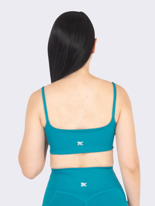 Top deportivo femenino esencial verde azul